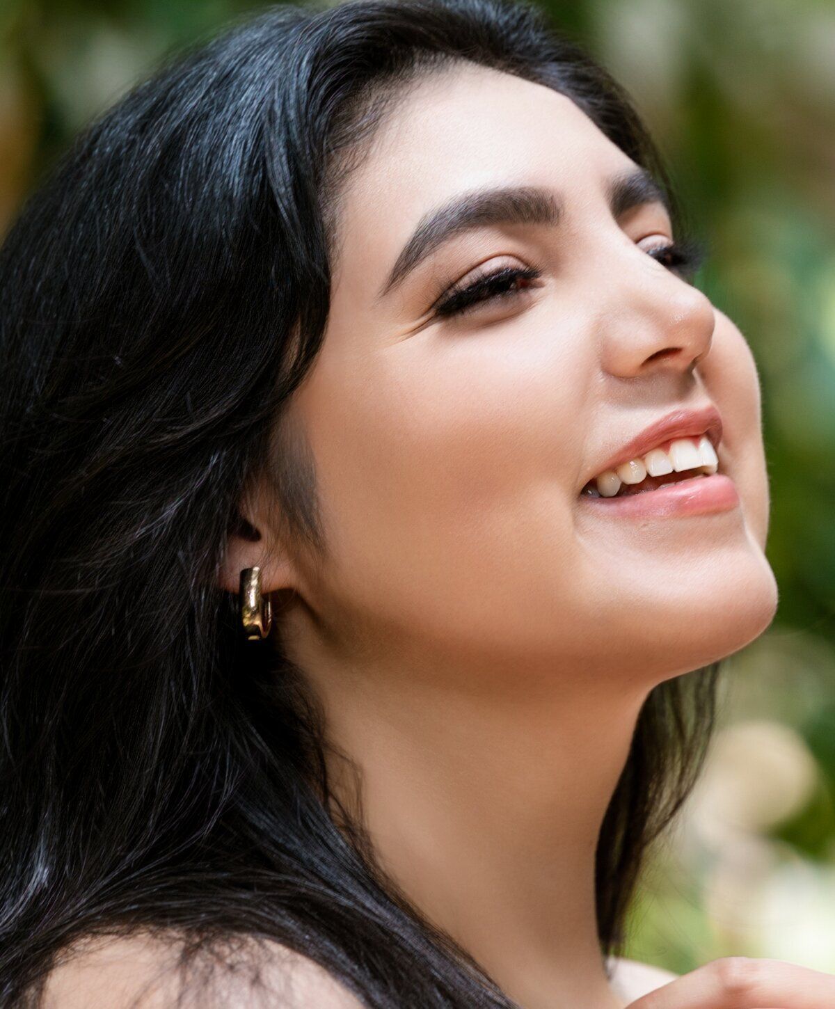 Profile portrait of a woman with wet hair.
