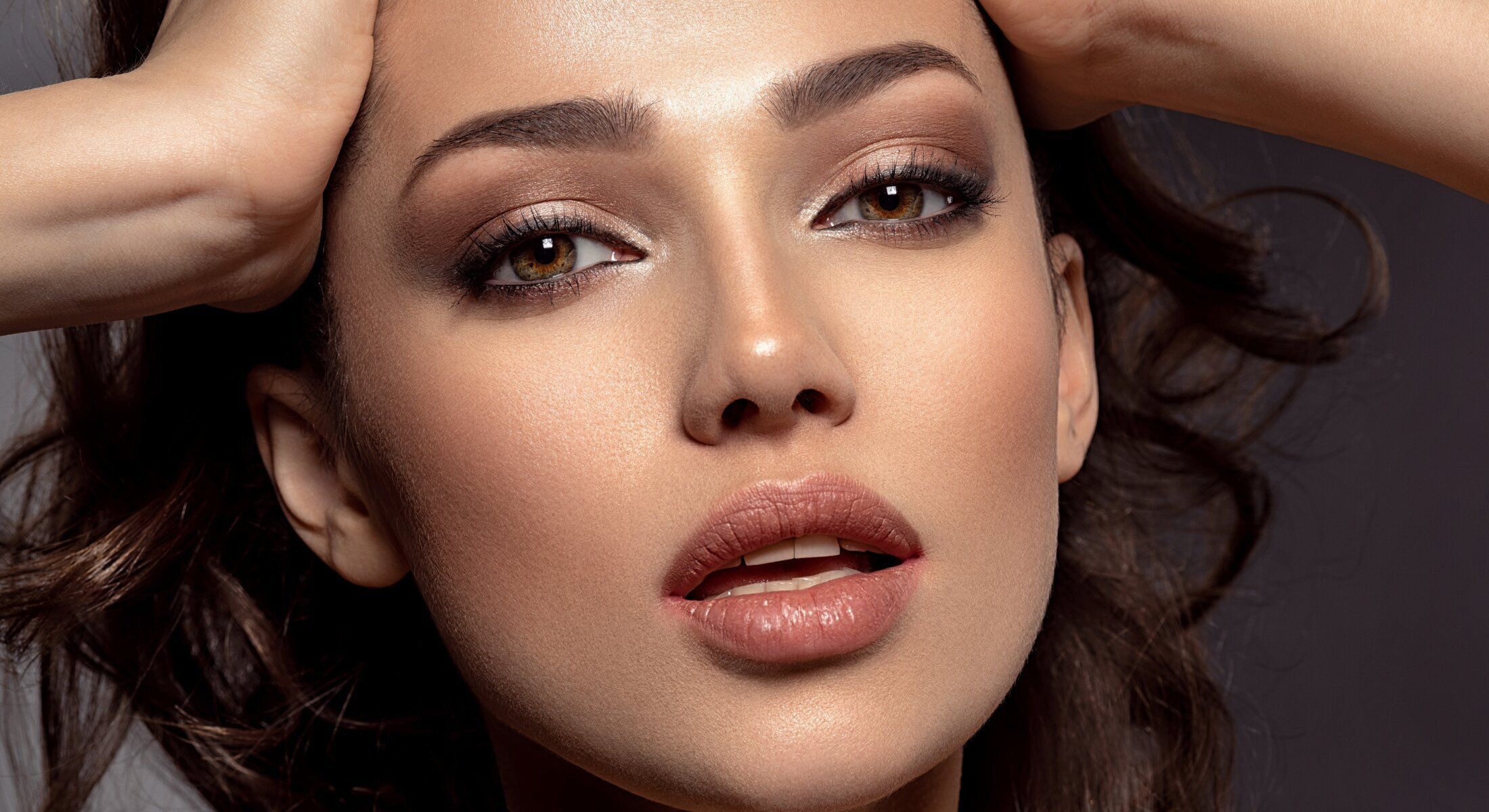 Close-up of a woman's face with makeup.