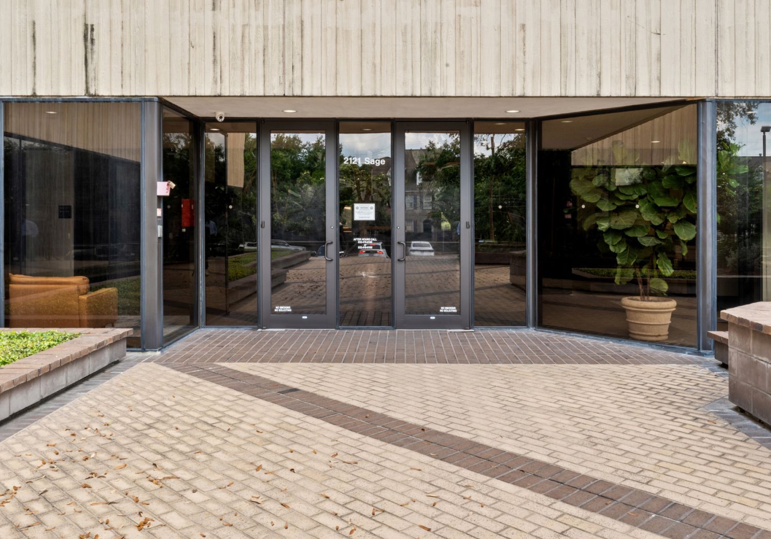 Entrance of building with glass doors.