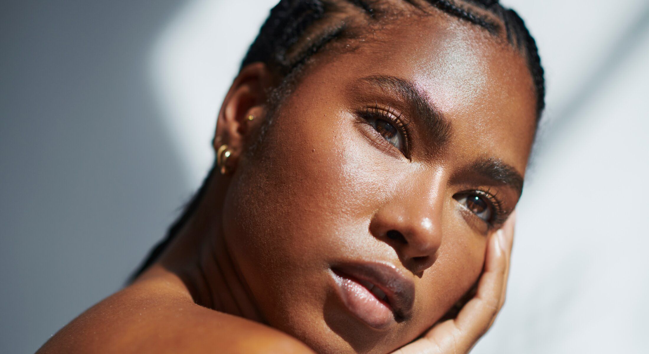 Close-up of a person with braided hair.