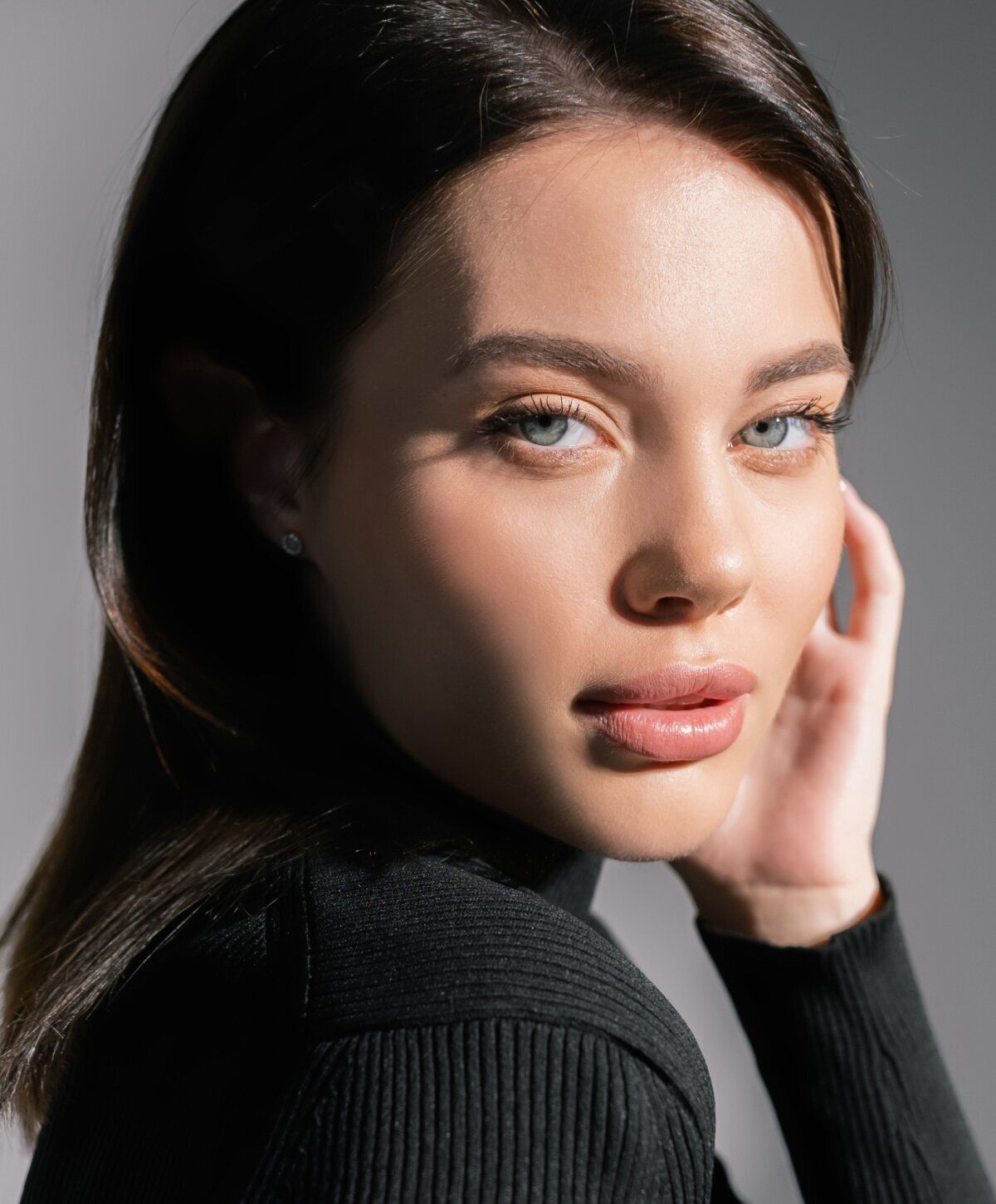 Portrait of a woman with striking blue eyes.