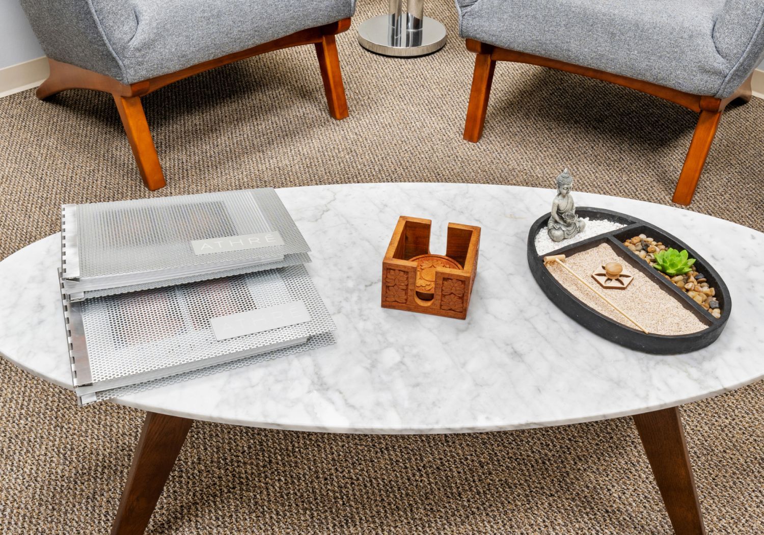 Coffee table with decorative items and textures.