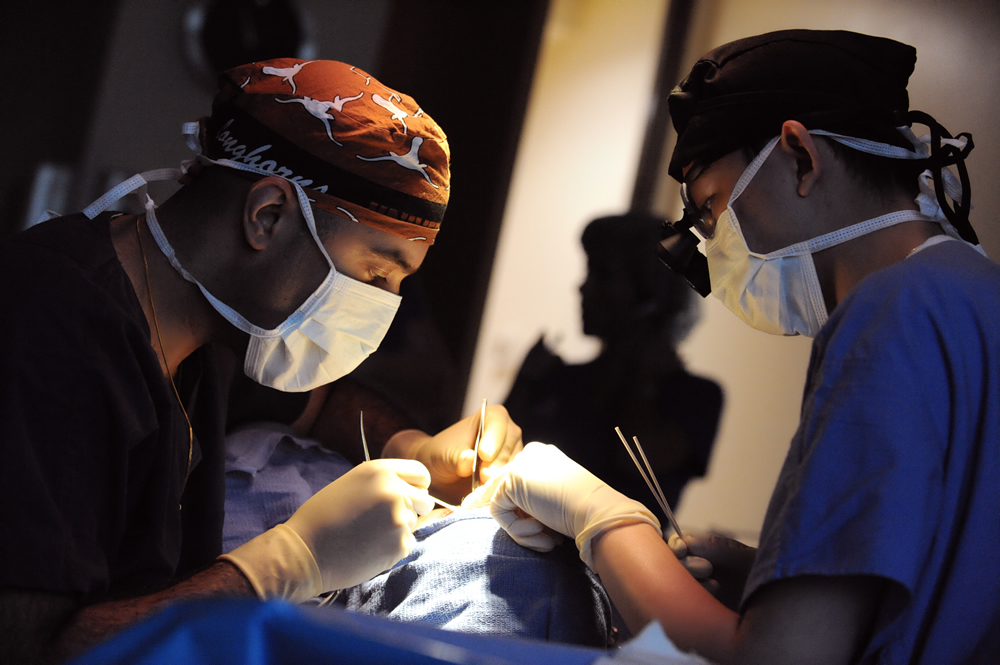 two doctors performing a surgery