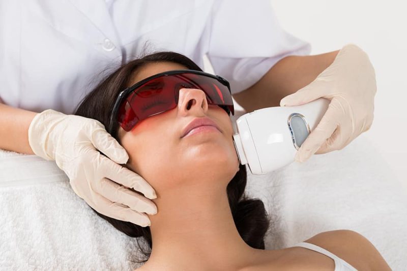 Beautician Giving Epilation Laser Treatment