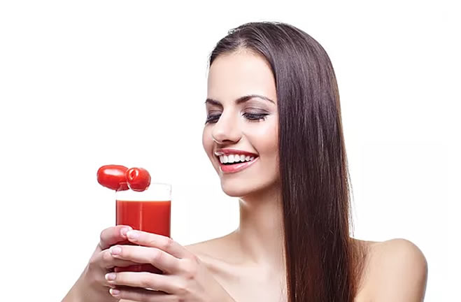 portrait of woman with tomato juice