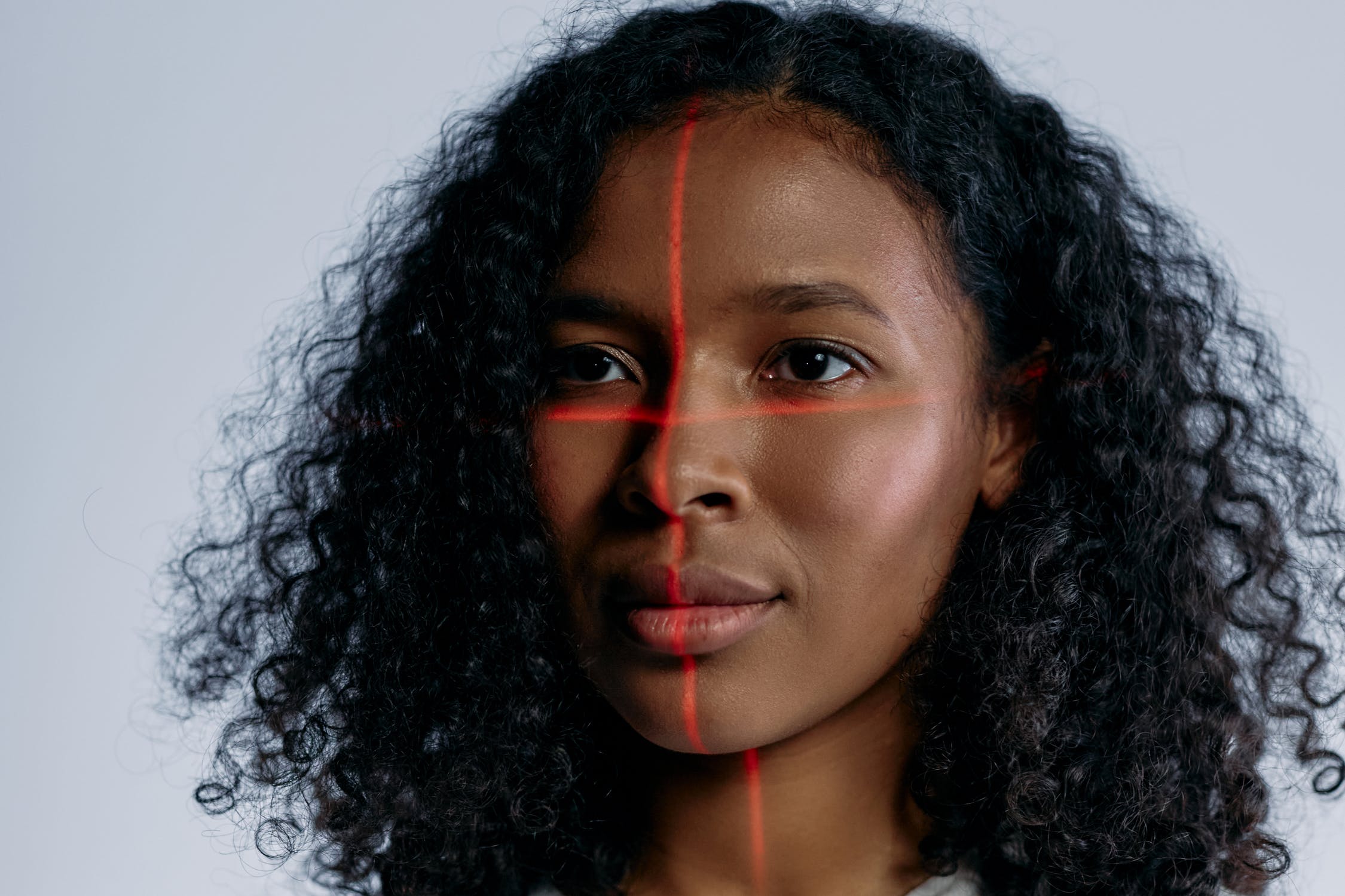 woman's face with red laser