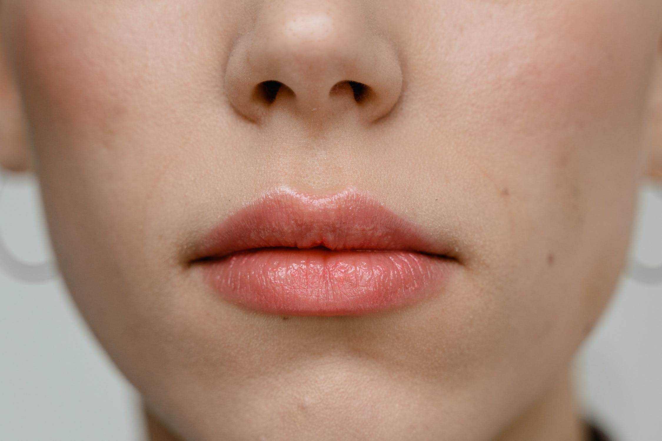 close up of woman's pink plump lips
