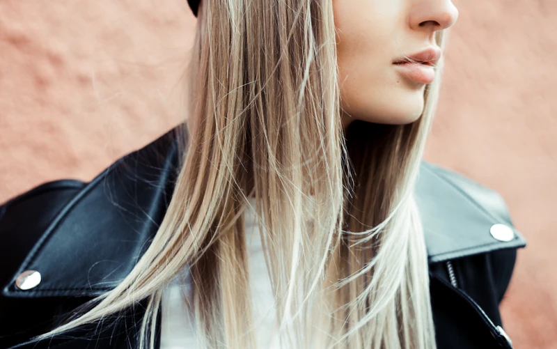 woman with straight blonde hair and full lips